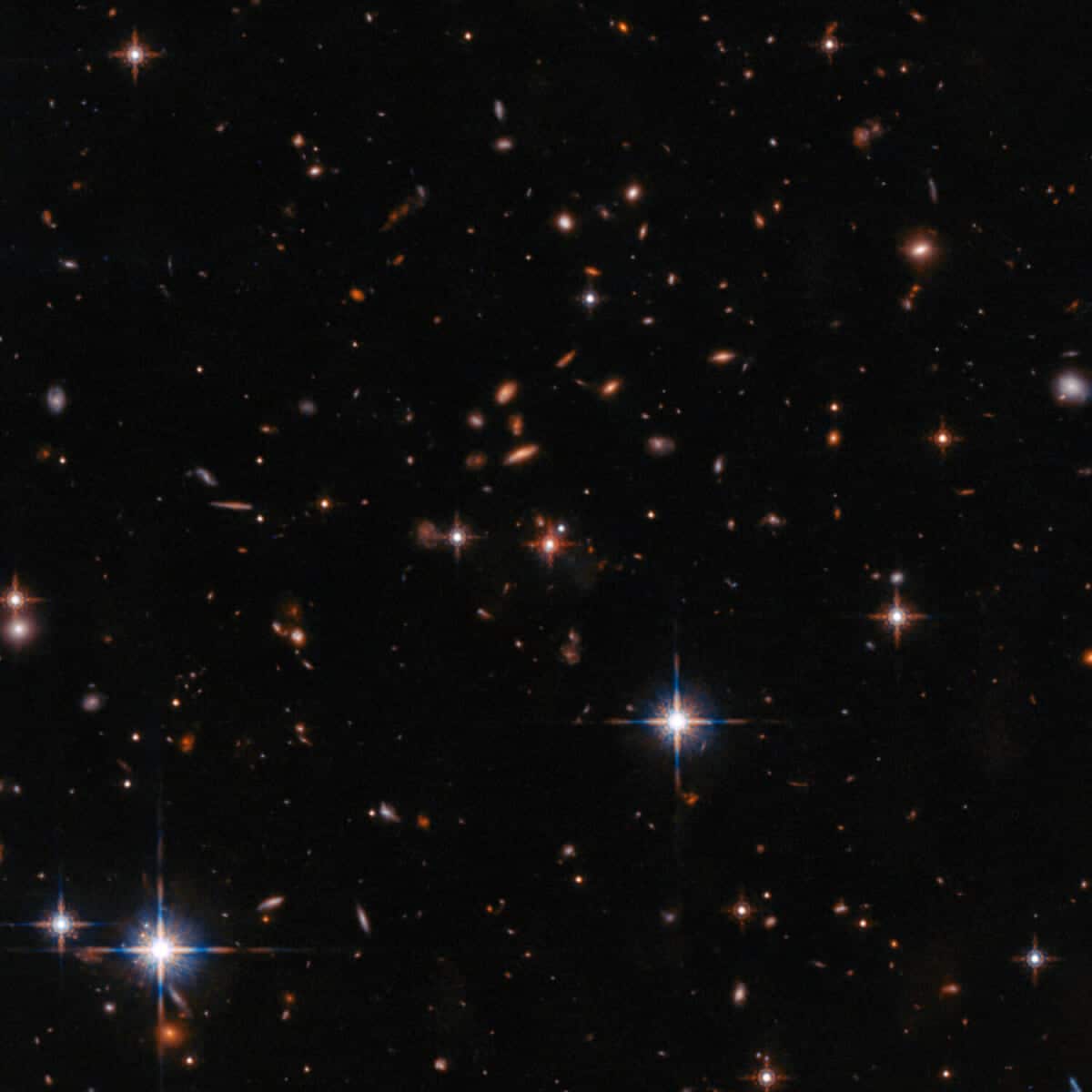 Wide field Hubble view of extremely red quasar SDSS J165202.64 172852.3